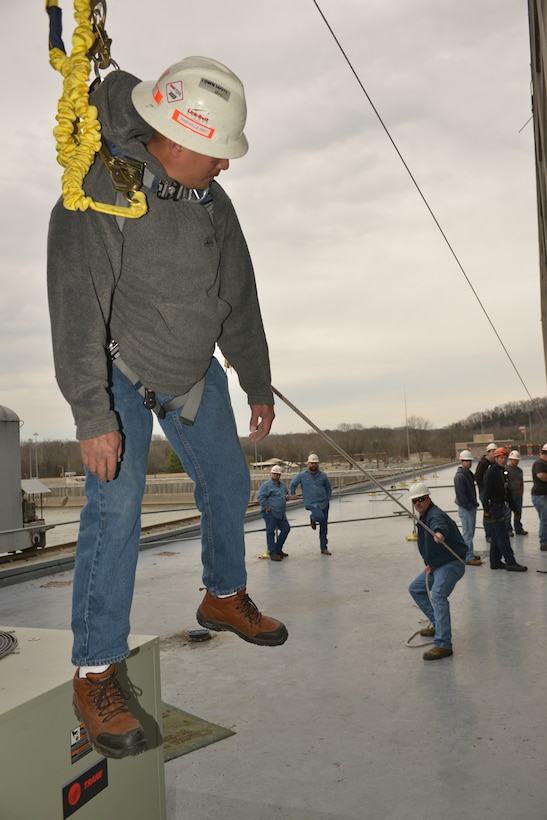 A group holds U.S. Army Corps of Engineers attending a fall and rescue training class holds Anthony Certeza suspended in the air during a simulation exercise at the Cheatham Power plant in Ashland City, Tenn.  The U.S. Army Corps of Engineers, Nashville District, Operations Division personnel recently went to new heights to prevent accidents by completing fall and rescue protection training with instructors.  