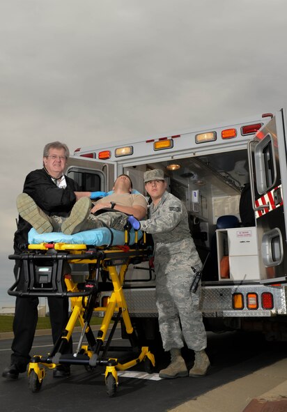 Roy Johnson, 2nd Medical Operations Squadron civilian paramedic, and Staff Sgt. Alexander Arrieta, 2nd MDOS paramedic, simulate transporting a patient at Barksdale Air Force Base, La., January 6, 2016. Once called upon, Barksdale’s team of paramedics can be anywhere on base within 12 minutes. (U.S. Air Force Photo/Airman 1st Mozer O. Class Da Chuna)