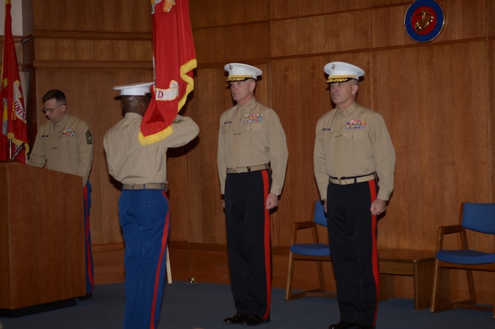 Sgt. Maj. Samuel Heyward presents the Marine Corps Recruiting Command colors to Lt. Gen. Mark Brilakis during the change of command ceremony on Dec. 17. Brig. Gen. Paul Kennedy (right) replaced Brilakis as commanding general of MCRC.