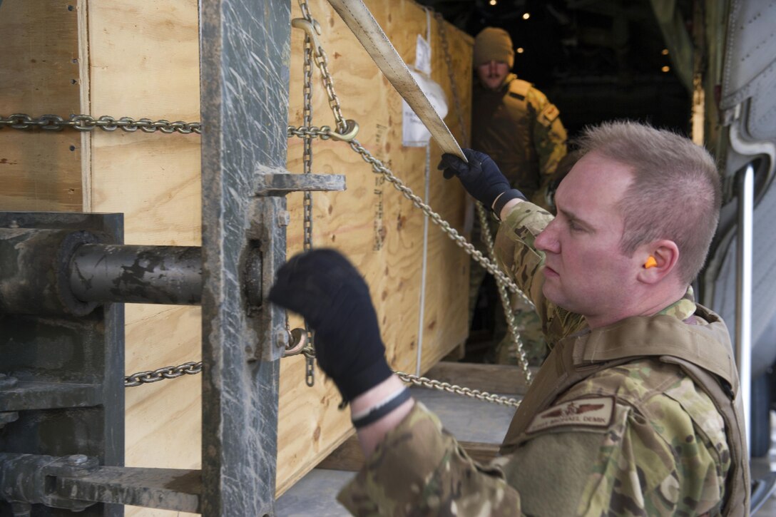 U.S. Air Force Staff Sgt. Michael Demik checks cargo being loaded onto a forklift at Camp Bastion, Afghanistan, Jan. 3, 2016. Demik is a loadmaster assigned to the 774th Expeditionary Airlift Squadron, deployed from Dyess Air Force Base, Texas. U.S. Air Force photo by Tech. Sgt. Robert Cloys