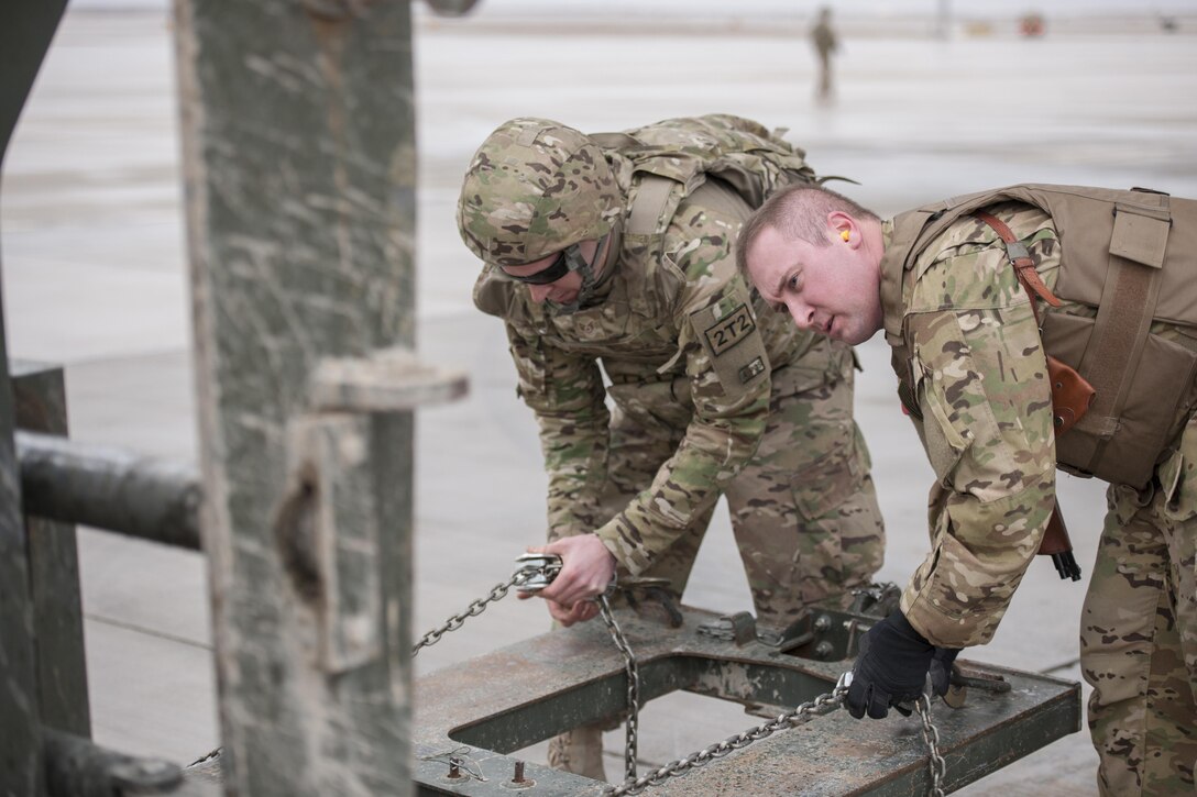 U.S. Air Force Staff Sgts. Michael Demik, right, and Logan Flaugher prepares a forklift to move a trailer at Camp Bastion, Afghanistan, Jan. 3, 2016. Demik is a loadmaster assigned to the 774th Expeditionary Airlift Squadron, deployed from Dyess Air Force Base, Texas, and Flaugher is assigned to the U.S. Central Command Materiel Recovery Element. U.S. Air Force photo by Tech. Sgt. Robert Cloys