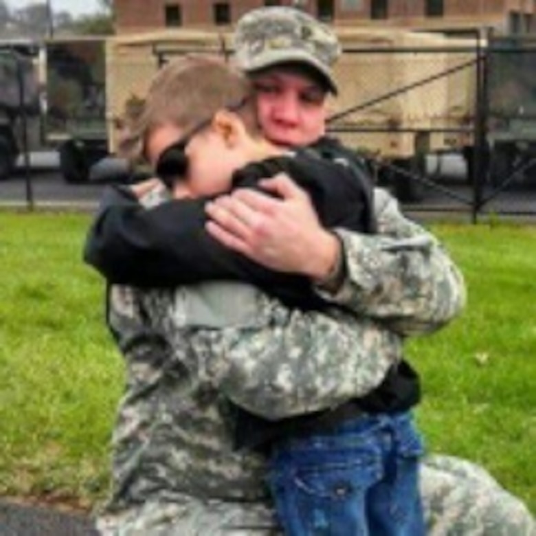 U.S. Army Reserve Sgt. Terry A. Speck Jr., medic, Headquarter and Headquarter Company, 854th Engineer Battalion, and Reading, Pa., native, hugs his son, Elias, after returning from deployment in March 2014. (Courtesy photo)