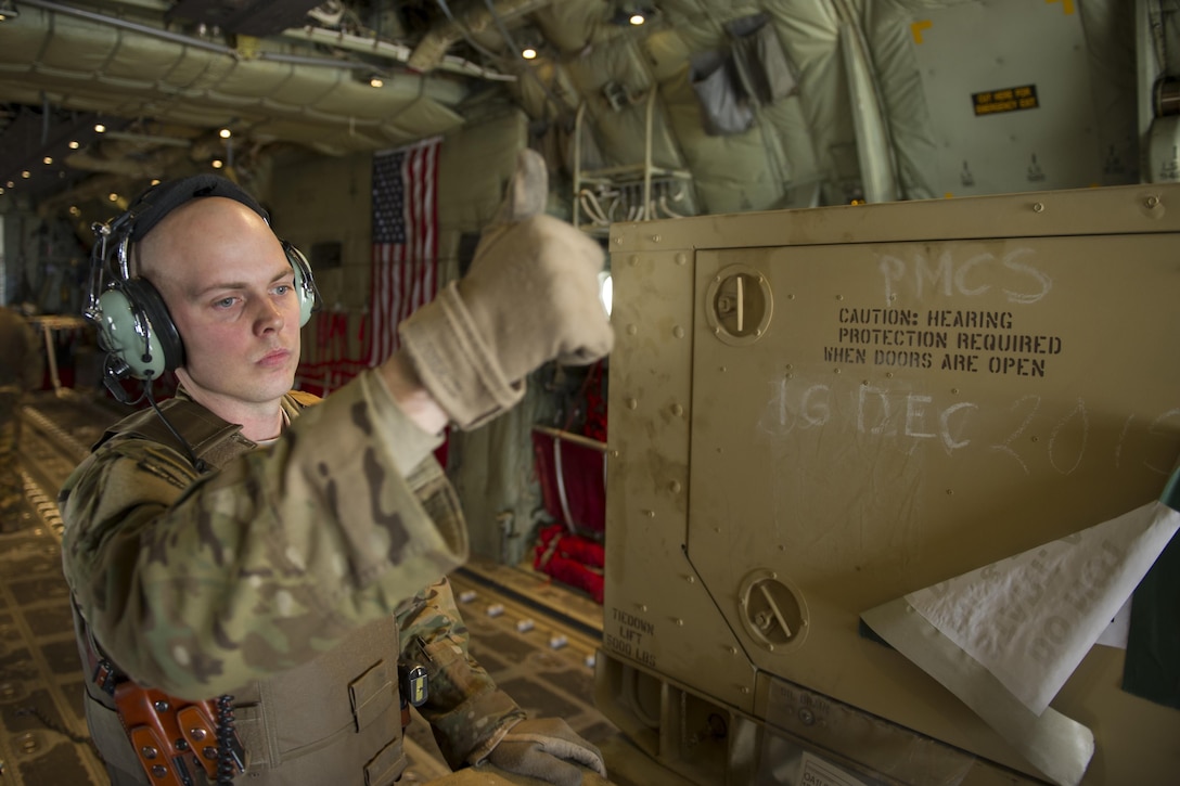 U.S. Air Force Staff Sgt. Justin King gives a thumbs-up as a generator is unloaded from a C-130J Super Hercules aircraft at Camp Bastion, Afghanistan, Jan. 3, 2016. King is a loadmaster assigned to the 774th Expeditionary Airlift Squadron, deployed from Dyess Air Force Base, Texas. U.S. Air Force photo by Tech. Sgt. Robert Cloys