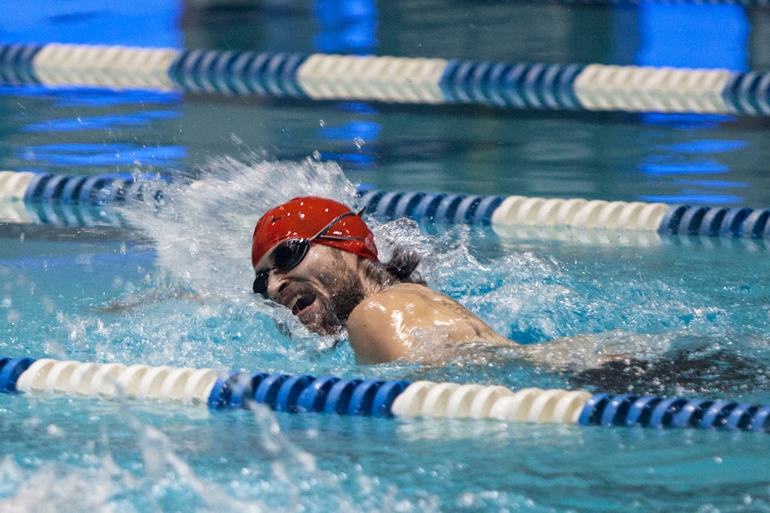 U.S. Marine Corps veteran Ray Hennagir competes during the swimming finals at the Freedom Aquatic and Fitness Center in Manassas, Va., June 27, 2015. Hennagir is a member of the 2015 Department of Defense (DoD) Warrior Games All-Marine Team. The 2015 DoD Warrior Games, held at Marine Corps Base Quantico June 19-28, is an adaptive sports competition for wounded, ill, and injured Service members and veterans from the U.S. Army, Marine Corps, Navy, Air Force, Special Operations Command, and the British Armed Forces. (U.S. Marine Corps photo by Cpl. Ashley Cano/Released)