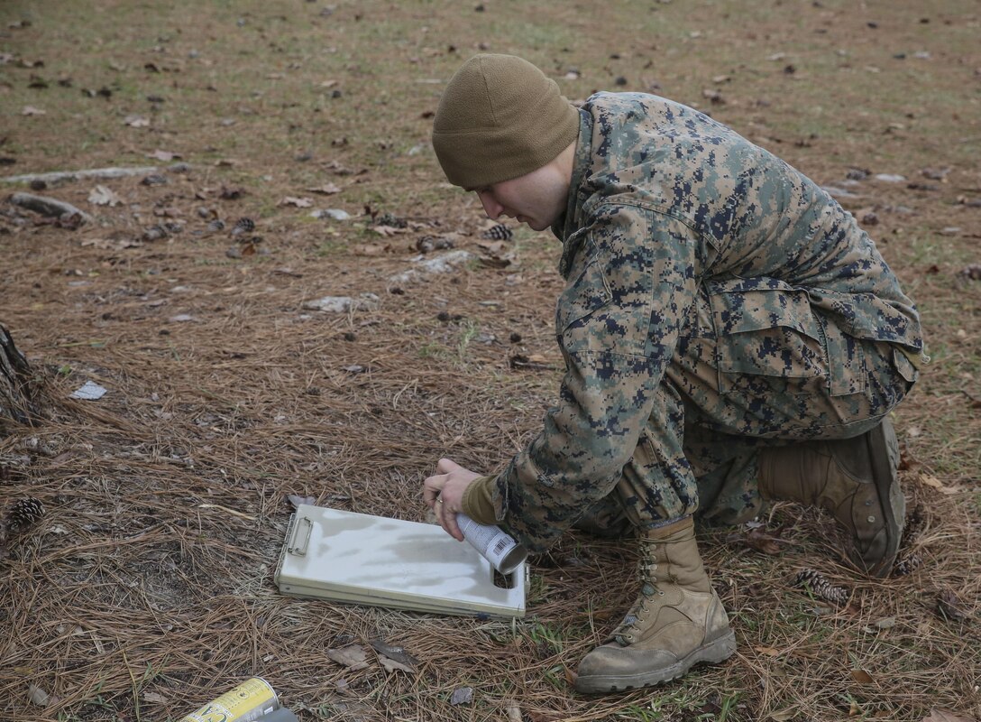 A Marine student undergoing the 2nd Marine Division Combat Skills Center Pre-Scout Sniper Course applies camouflage at Camp Lejeune, N.C., Jan. 6, 2016. The three-week course is designed to prepare qualified Marines for the Scout Sniper Basic Course, and instructs them in skills such as stalking, camouflage, land navigation and marksmanship. (U.S. Marine Corps photo by Cpl. Paul S. Martinez/Released)