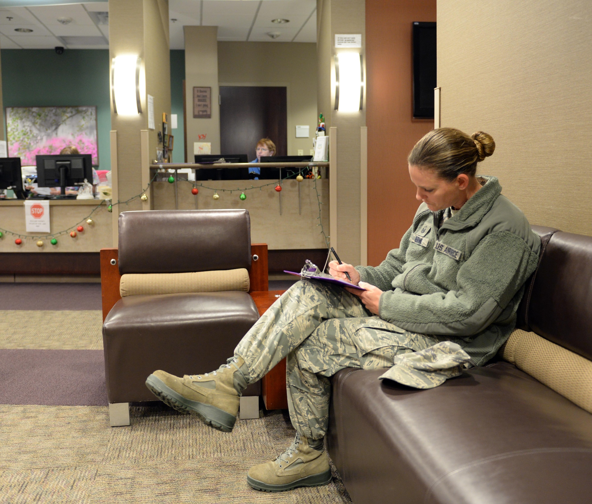 Master Sgt. Brandi Burns, 2nd Force Support Squadron first sergeant, fills out paperwork for an appointment at the 2nd Medical Group at Barksdale Air Force Base, La., Dec. 28, 2015. The 2nd MDG has an appointment reminder system in place which calls patients two days prior to an appointment with a message identifying the appointment date and time. However, the appointment reminder system uses phone numbers listed in the Defense Enrollment Eligibility Reporting System, so it’s critical to maintain updated contact information in DEERS. (U.S. Air Force photo/Airman 1st Class Curt Beach)
