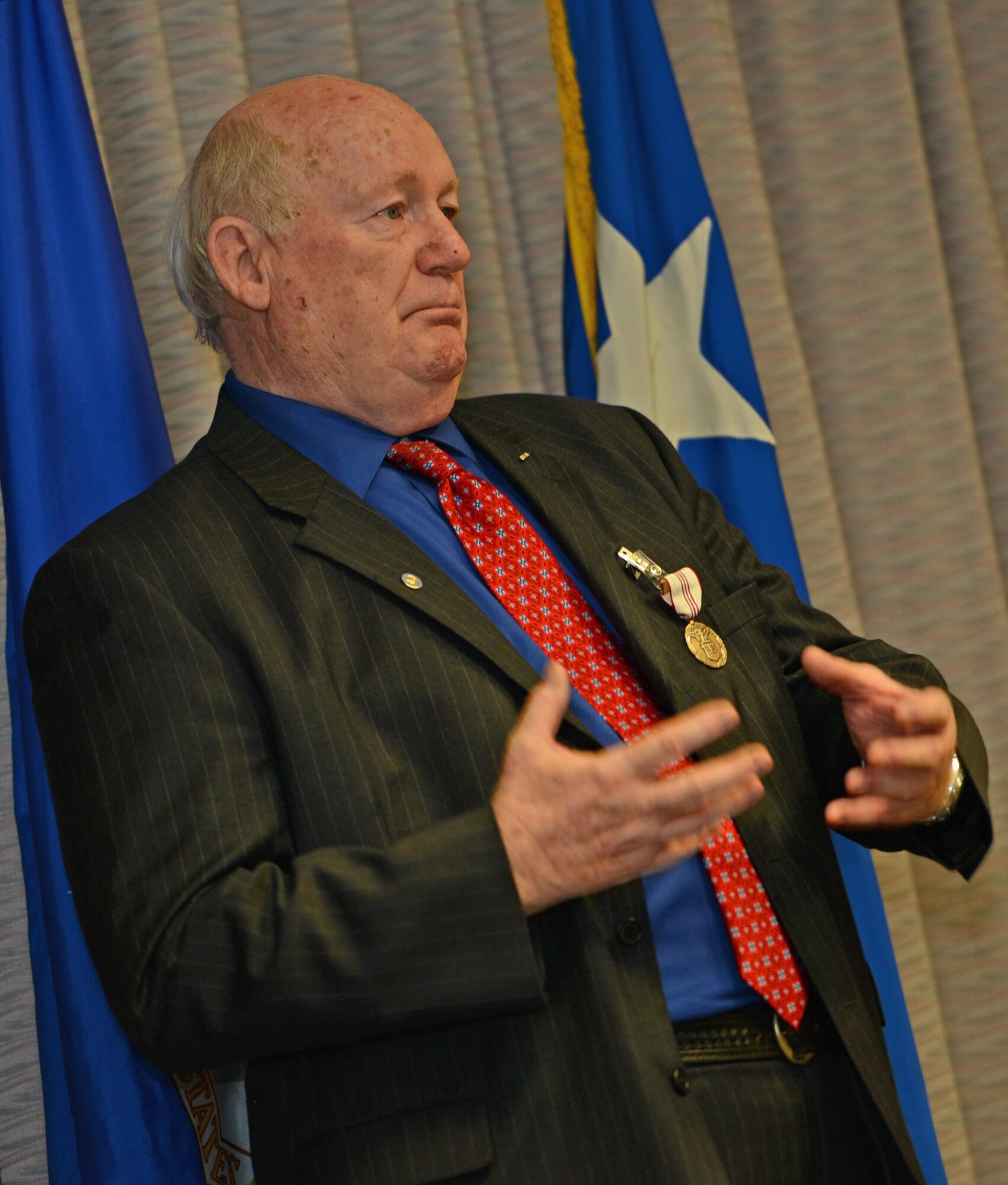 Herb Mason, Air Force Special Operations Command historian, speaks at his retirement ceremony on Hurlburt Field, Fla., Jan. 7, 2016. Mason served from April 28, 1965 to Jan. 3, 2016, making him the longest serving historian in Air Force history. (U.S. Air Force photo/Staff Sgt. Melanie Holochwost)