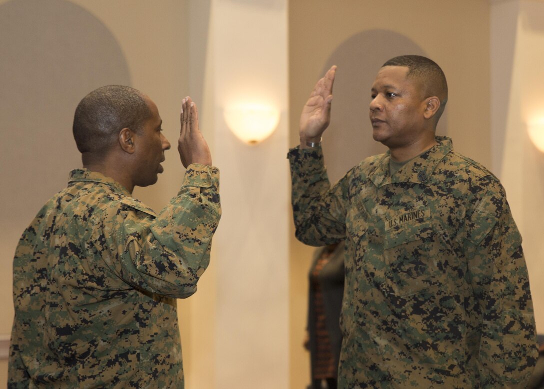 Master Gunnery Sgt. Shaun Hickman, staff noncommissioned officer of the maintenance section, Headquarters and Service Company, Marine Barracks Washington, D.C., recites the Oath of Enlistment during his promotion ceremony in Crawford Hall, Jan. 6, 2016. (Official Marine Corps photos by Gunnery Sgt. Damon Davoren/Released)