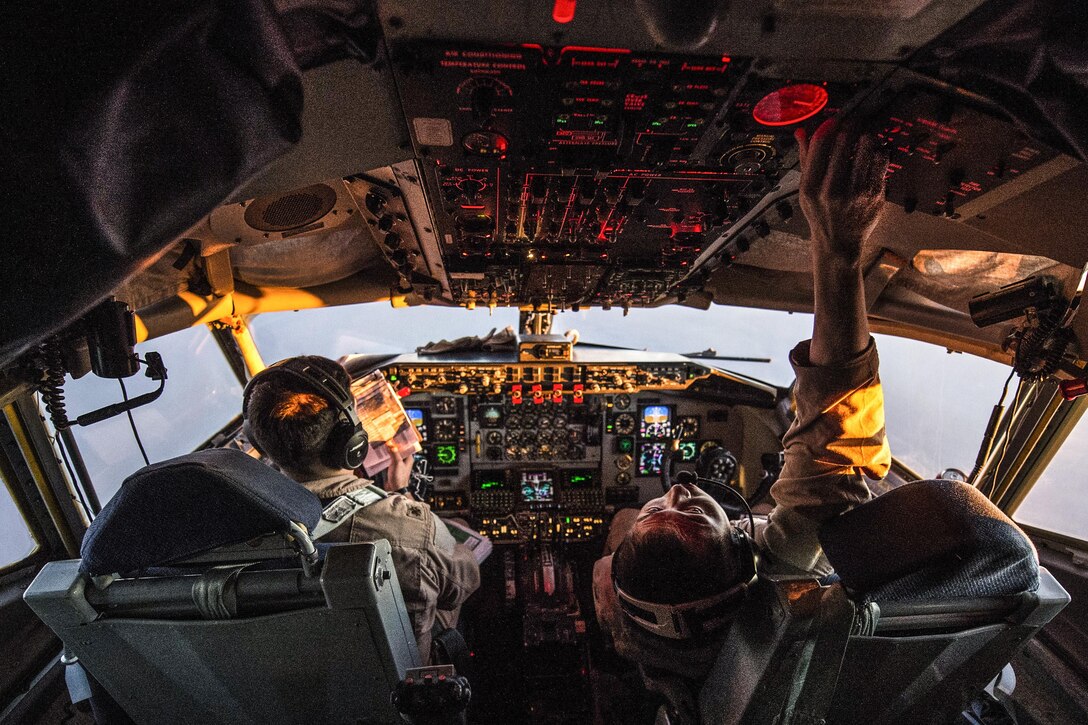 U.S Air Force Major Steve Briones, left, and 1st Lt. Andrew Kim fly a KC-135 Stratotanker over Turkey, Jan. 6, 2016. Coalition forces fly daily missions to support Operation Inherent Resolve. U.S. Air Force photo by Staff Sgt. Corey Hook