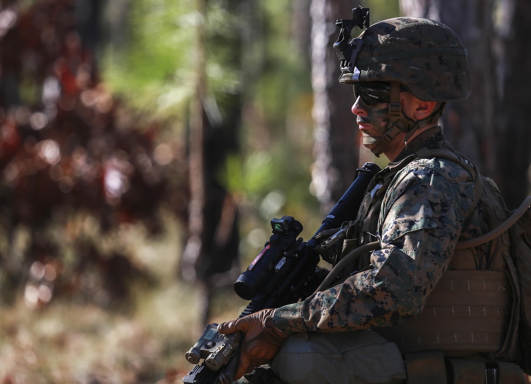 A U.S. Marine with Battalion Landing Team, 1st Battalion, 6th Marine Regiment (BLT 1/6), 22nd Marine Expeditionary Unit,  patrols through the woods of Camp Lejeune, N.C., Dec. 16, 2015. The exercise allowed the Marines to practice setting up patrol bases and enhances basic infantry principles. (Official Marine Corps photo by Cpl. Ryan G. Coleman/released)