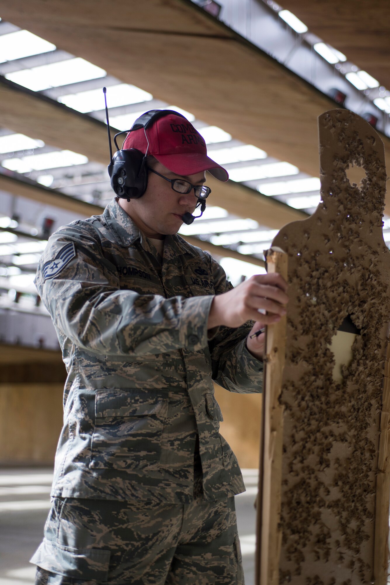 U.S. Air Force Staff Sgt. Robert Thompson, 23d Security Forces Squadron NCO in charge of the armory, marks the target to determine the shooter’s score, Jan. 6, 2016, at Moody Air Force Base. Airmen fire more than 190 rounds during the shooting portion of the course. (U.S. Air Force photo by Airman Daniel Snider/Released)