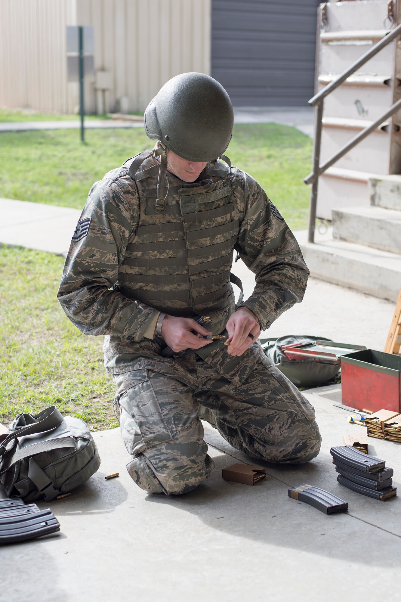 U.S. Air Force Staff Sgt. Edward Rocha, 23d Civil Engineer Squadron water and fuels systems technician, prepares his ammunition, Jan. 6, 2016, at Moody Air Force Base. Being able to load, unload and troubleshoot weapon malfunctions are all essential skills taught during the combat arms training and maintenance course. (U.S. Air Force photo by Airman Daniel Snider/Released)