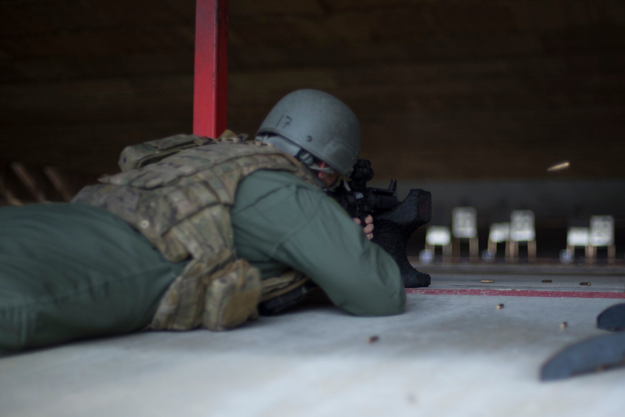 U.S. Air Force Master Sgt. Randy VanHorn, 41st Rescue Squadron flight chief, fires a round into his target, Jan. 6, 2016, at Moody Air Force Base, Ga. Airmen fire from an array of positions including supported and unsupported prone, kneeling and standing. (U.S. Air Force photo by Airman Daniel Snider/Released)
