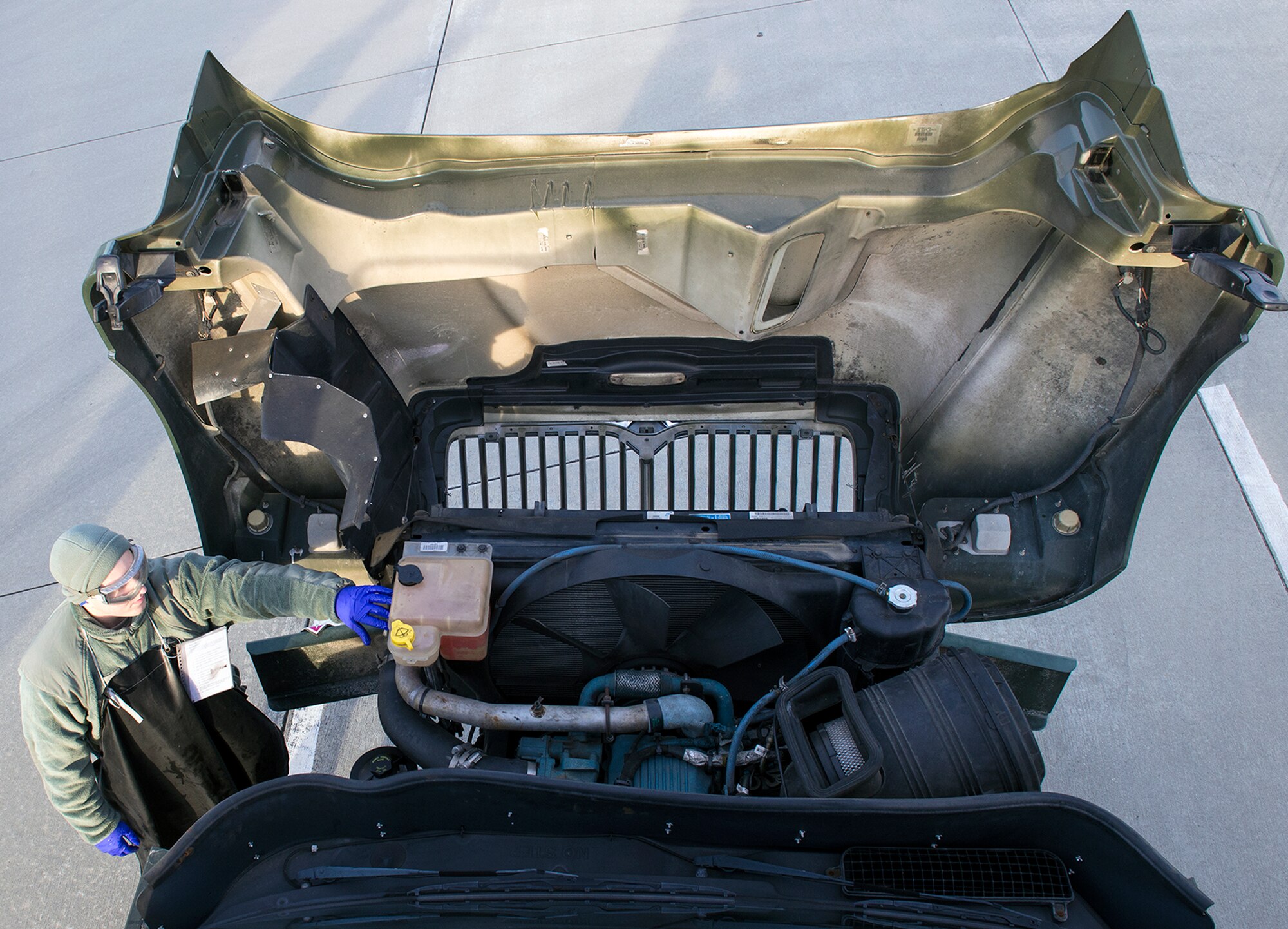 U.S. Air Force Airman Brendan Melms, 23d Logistics Readiness Squadron fuels distribution operator, checks the engine coolant of an R-11 refueling truck during a checkpoint inspection, Jan. 6, 2016, at Moody Air Force Base, Ga. The daily inspection is performed to identify and correct any discrepancies with the vehicle fleet to prevent damage to aircraft and other equipment.
(U.S. Air Force photo by Airman 1st Class Greg Nash/Released)
