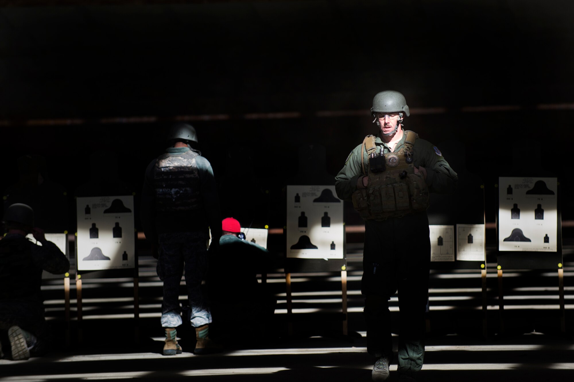 U.S. Air Force Master Sgt. Randy VanHorn, 41st Rescue Squadron flight chief, returns to the firing line after scoring his targets, Jan. 6, 2016, at Moody Air Force Base, Ga. Practice shots help Airmen adjust their weapon to be more accurate. (U.S. Air Force photo by Airman Daniel Snider/Released)
