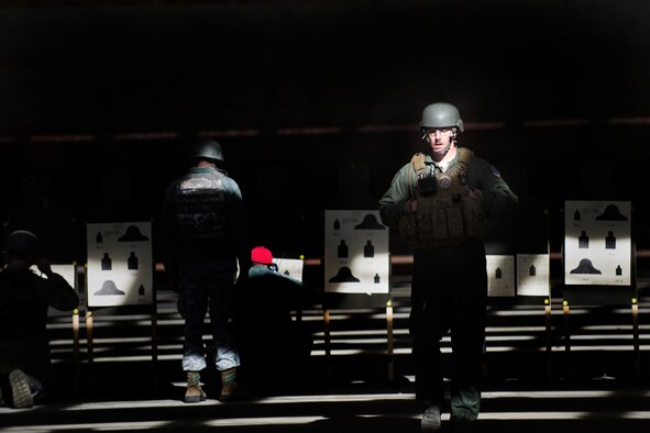 U.S. Air Force Master Sgt. Randy VanHorn, 41st Rescue Squadron flight chief, returns to the firing line after scoring his targets, Jan. 6, 2016, at Moody Air Force Base, Ga. Practice shots help Airmen adjust their weapon to be more accurate. (U.S. Air Force photo by Airman Daniel Snider/Released)