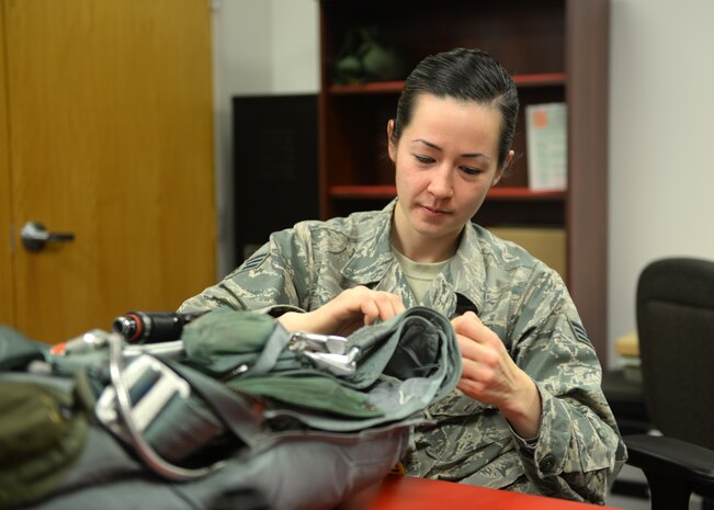 Senior Airman Sarah Phillips, 9th Operations Support Squadron Aircrew Flight Equipment technician, repairs a parachute Jan. 7, 2016, at Beale Air Force Base, California. Beale’s Aircrew Flight Equipment technicians ensure T-38 Talon pilots are equipped with well-maintained and serviceable flight-gear. The T-38 is primarily used by the Air Education and Training Command as a training aircraft, but at Beale it is used as a familiarization aircraft when pilots are not flying the U-2 Dragon Lady. (U.S. Air Force photo by Airman 1st Class Ramon A. Adelan)