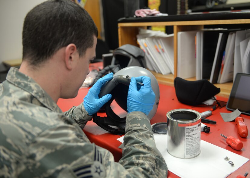 Senior Airman Joseph Tharp, 9th Operations Support Squadron Aircrew Flight Equipment technician, patches a damaged area on a flight helmet Jan. 7, 2016, at Beale Air Force Base, California. Beale’s Aircrew Flight Equipment technicians ensure T-38 Talon pilots are equipped with well-maintained and serviceable flight-gear. The T-38 is primarily used by the Air Education and Training Command as a training aircraft, but at Beale it is used as a familiarization aircraft when pilots are not flying the U-2 Dragon Lady. (U.S. Air Force photo by Airman 1st Class Ramon A. Adelan)