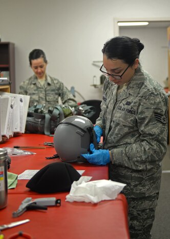 Staff Sgt. Andrea Mulgado, 9th Operations Support Squadron Aircrew Flight Equipment technician, conducts a routine inspection on a flight helmet Jan. 7, 2016, at Beale Air Force Base, California. Beale’s Aircrew Flight Equipment technicians ensure T-38 Talon pilots are equipped with well-maintained and serviceable flight-gear. The T-38 is primarily used by the Air Education and Training Command as a training aircraft, but at Beale it is used as a familiarization aircraft when pilots are not flying the U-2 Dragon Lady. (U.S. Air Force photo by Airman 1st Class Ramon A. Adelan) 