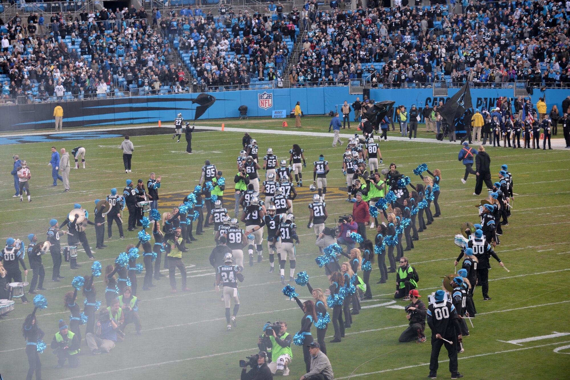 The Carolina Panthers are being introduced onto the field during the Panthers vs. Buccaneers game, Jan. 3, 2016, at Bank of America Stadium in Charlotte, North Carolina. The National Football League reserved eight seats in the stadium for military service members. (U.S. Air Force photo/Airman 1st Class Ashley Williamson)