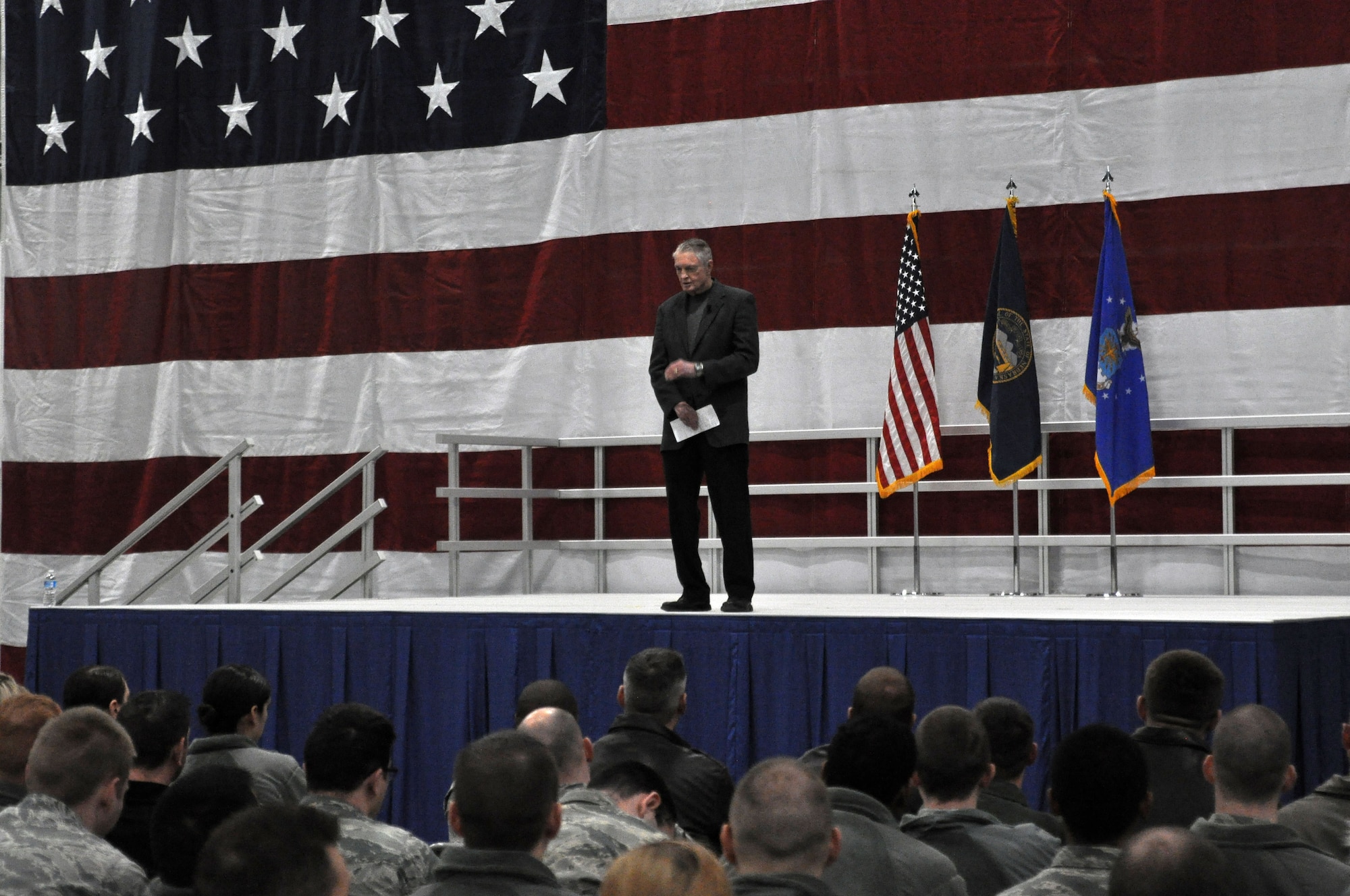Retired Nebraska Cornhuskers coach, Tom Osborne, speaks to Team Offutt about integrity in the Bennie Davis Maintenance Facility, Offutt Air Force Base, Neb., Jan. 5. Osborne not only spent 25 years coaching, he also served in the Army Reserves. (U.S. Air Force photo by Senior Airman Rachel Hammes)
