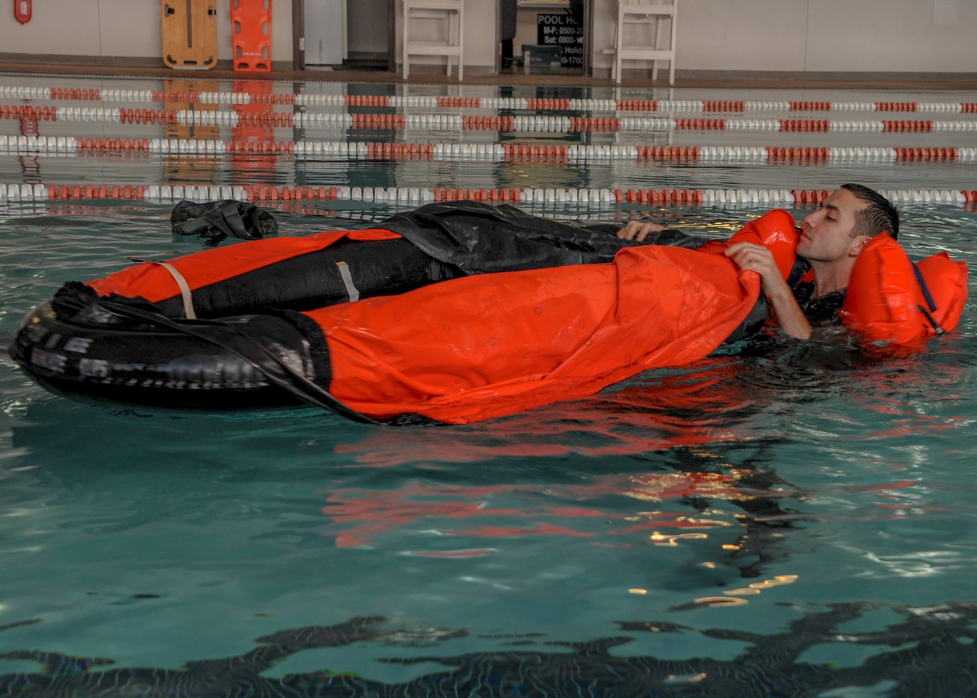 U.S. Air Force Capt. Nicholas Answine, 43th Electronic Combat Squadron navigator, prepares to enter a life raft during Survival, Evasion, Resistance, Escape training refresher at Davis-Monthan Air Force Base, Ariz., Jan. 6, 2016. In the event of an emergency the personal rafts allows victims to remove themselves from water to help avoid hypothermia. (U.S. Air Force photo by Airmen 1st Class Ashley N. Steffen/Released) 