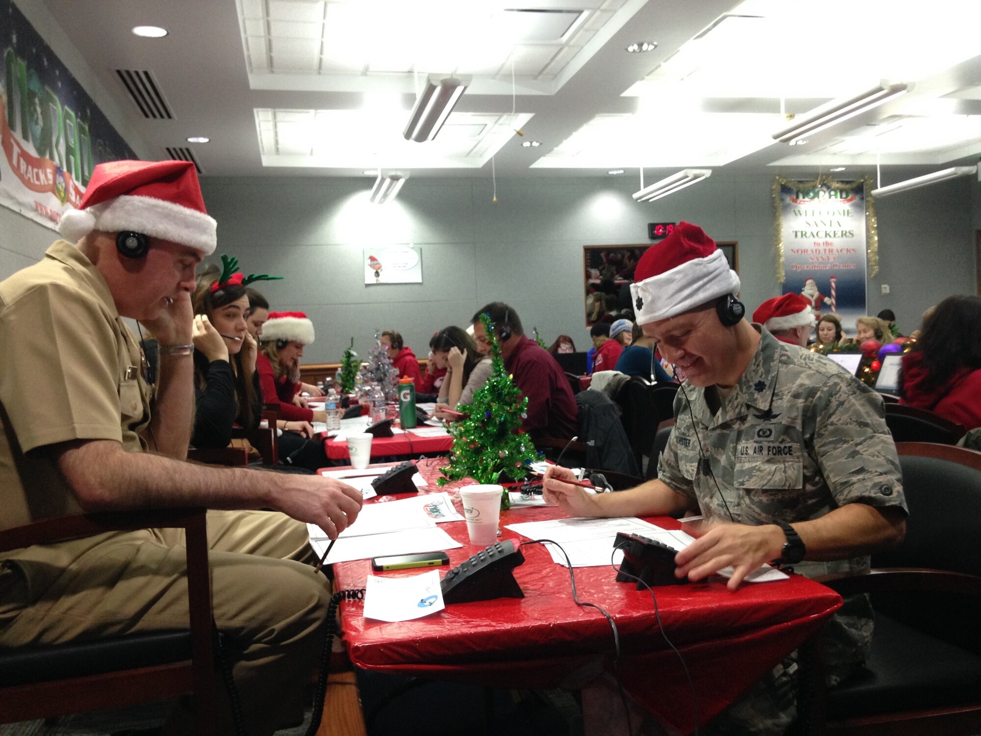 U.S. Air Force Reserve Lt. Col. Stan Richister, 960th Network Operations Squadron director of operations, and more than 1,500 other volunteers from Peterson Air Force Base, Colo., and the surrounding communities answer calls during the NORAD Tracks Santa program, Dec. 24, 2015. The volunteers fielded nearly 141,000 calls from around the world starting at 6 a.m. EST on Christmas Eve, detailing the whereabouts of Santa for adults and children alike. (U.S. Air Force Photo/Mike Pierson)