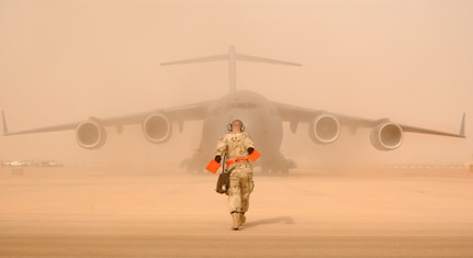 JOINT BASE CHARLESTON, SC -- In support of OIF, 15 C-17As from the 437th and 62nd AWs took off from Aviano AB, Italy, and airdropped 1,000 Sky Soldiers. At a staging base in Europe, C-17s from McChord AFB and Charleston AFB line the pad in preparation for airdrop and airland missions to Iraq. On the first night, they dropped 20 members of the 86th Expeditionary Contingency Response Group along with more than a thousand paratroopers (Sky Soldiers) from the 173d Airborne Brigade. This marked the first C-17 combat insertion of paratroopers. On subsequent nights, they delivered more than a million pounds of personnel and cargo. (Courtesy Photo)