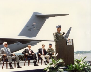 JOINT BASE CHARLESTON, SC -- Brig. Gen. Thomas Mikolajcik, 437th Airlift Wing commander, addresses a crowd of distinguished guests at a ceremony honoring the arrival of the first U.S. Air Force C-17 Globemaster III cargo plane to Charleston Air Force Base, June 14, 1993.  The wing continued receiving C-17s over the next 20 years and now shares the title of the largest C-17 fleet in the Air Force. (Courtesy Photo)