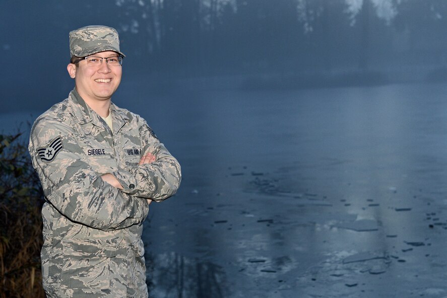 Staff Sgt. Matthew Siegele, 627th Force Support Squadron sports and fitness noncommissioned officer in charge, poses for a photo Jan. 6, 2016 at Carter Lake, Joint Base Lewis-McChord, Wash. Siegele saved a little girl from drowning on the afternoon of Jan. 1, when she was walking on a frozen lake and fell through the ice. (U.S. Air Force photo/Senior Airman Divine Cox)