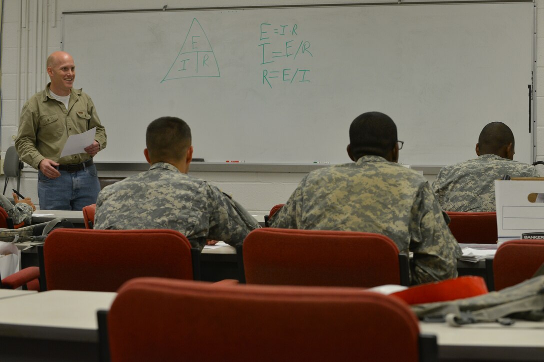 William Armstrong, a railway operations instructor with the Maritime Intermodal Training Department, goes over railway operations course work at Fort Eustis, Va., Oct. 16, 2015. Railway operation is a new military field which was consolidated from three previous railroad specialties. (U.S. Air Force photo by Staff Sgt. Natasha Stannard)