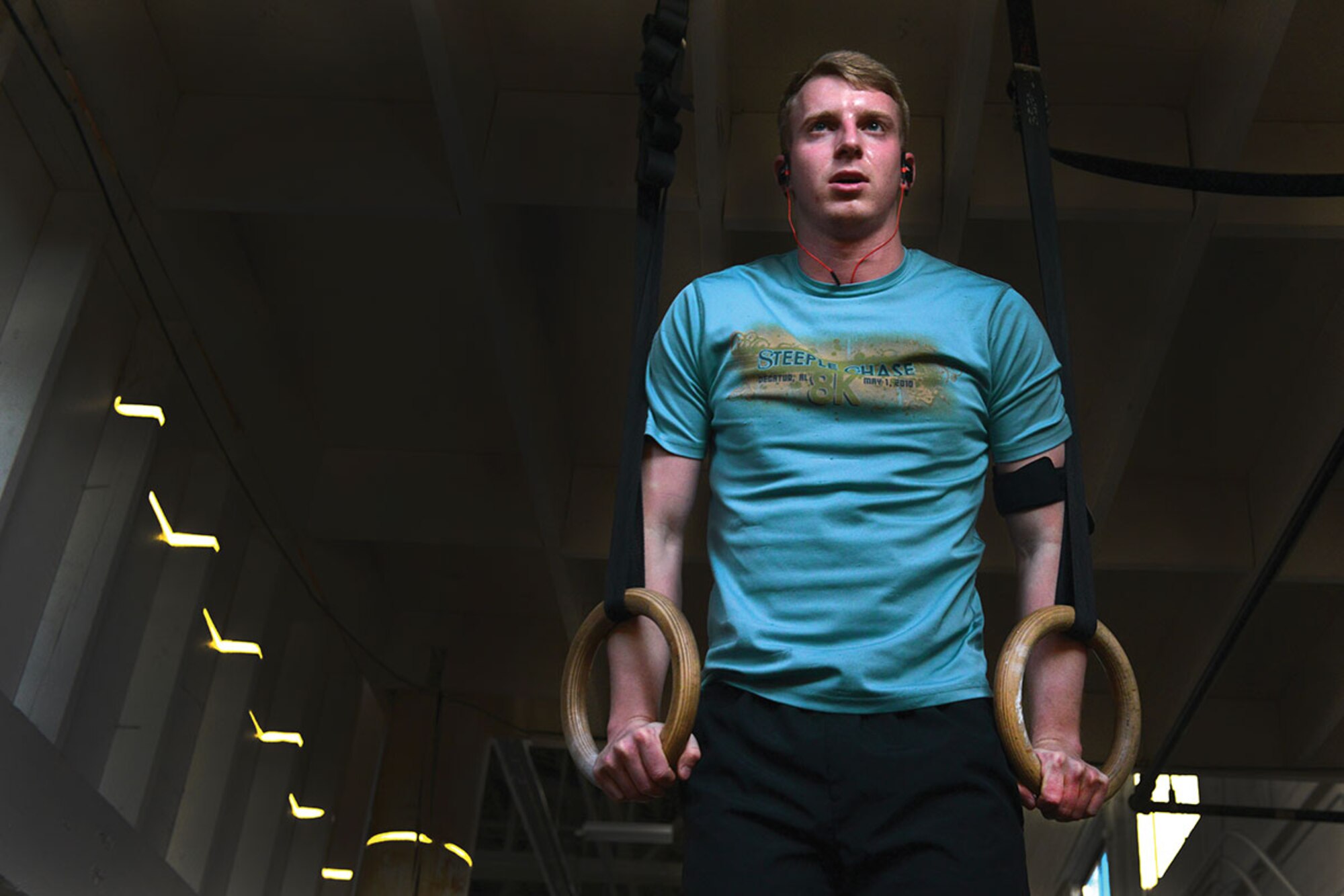 U.S. Army 1st Lt. John Bolding a platoon leader with C Company,1st Battalion (Airborne), 501st Infantry Regiment does muscle-ups in Hangar 5 December 31. As the new year comes, many will find the different fitness locations around JBER to be more trafficked, for information on what fitness centers are available, consult the front desk at either Buckner Physical Fitness Center, or Elmendorf Physical Fitness Center. (U.S. Air Force photo by Airman 1st Class Kyle Johnson)