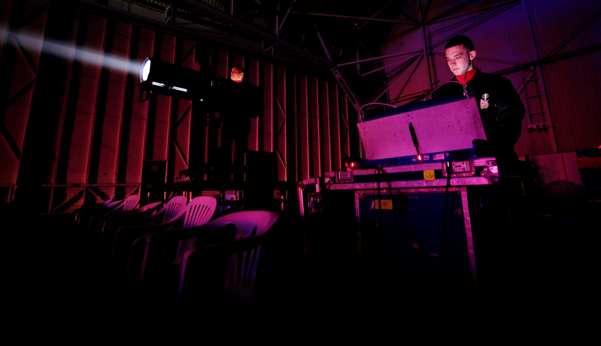 Tops in Blue technical staff members control background equipment during the 2015, “Freedom’s Song” world tour performance Jan. 6, 2016, at Incirlik Air Base, Turkey. Tops in Blue visited Incirlik AB as part of their seven-month tour which includes 75 shows in 20 different countries.  (U.S. Air Force photo by Senior Airman Krystal Ardrey)