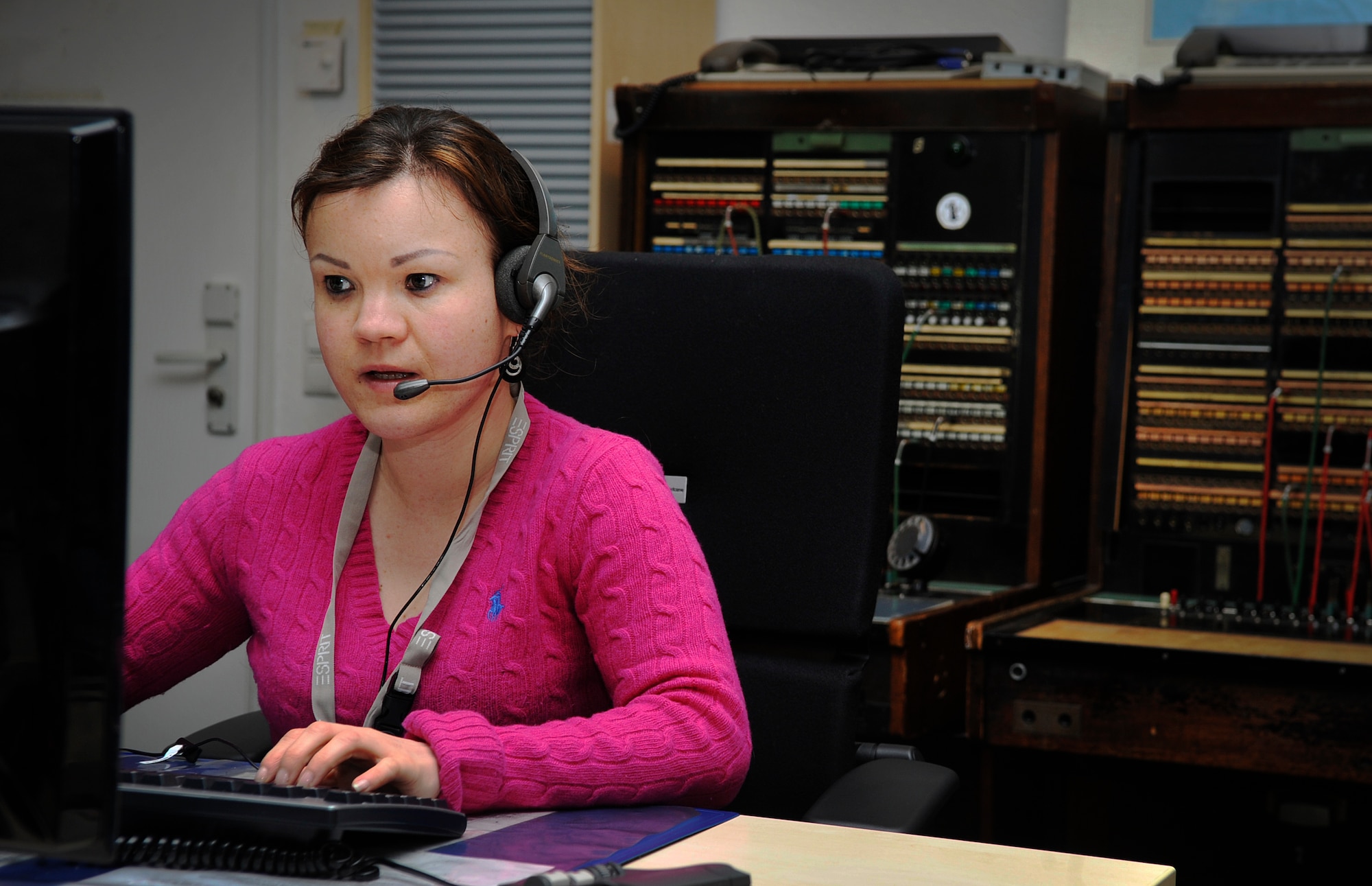 Verena Klein, 86th Communications Squadron consolidated switchboard operator, transfers a caller to the appropriate organization Jan. 4, 2015, at Ramstein Air Base, Germany. The operators answer more than 1.5 million calls annually and service the Air Force, Army, Navy, Marines and U.S. State Department personnel around the world. (U.S. Air Force photo/Airman 1st Class Larissa Greatwood)
