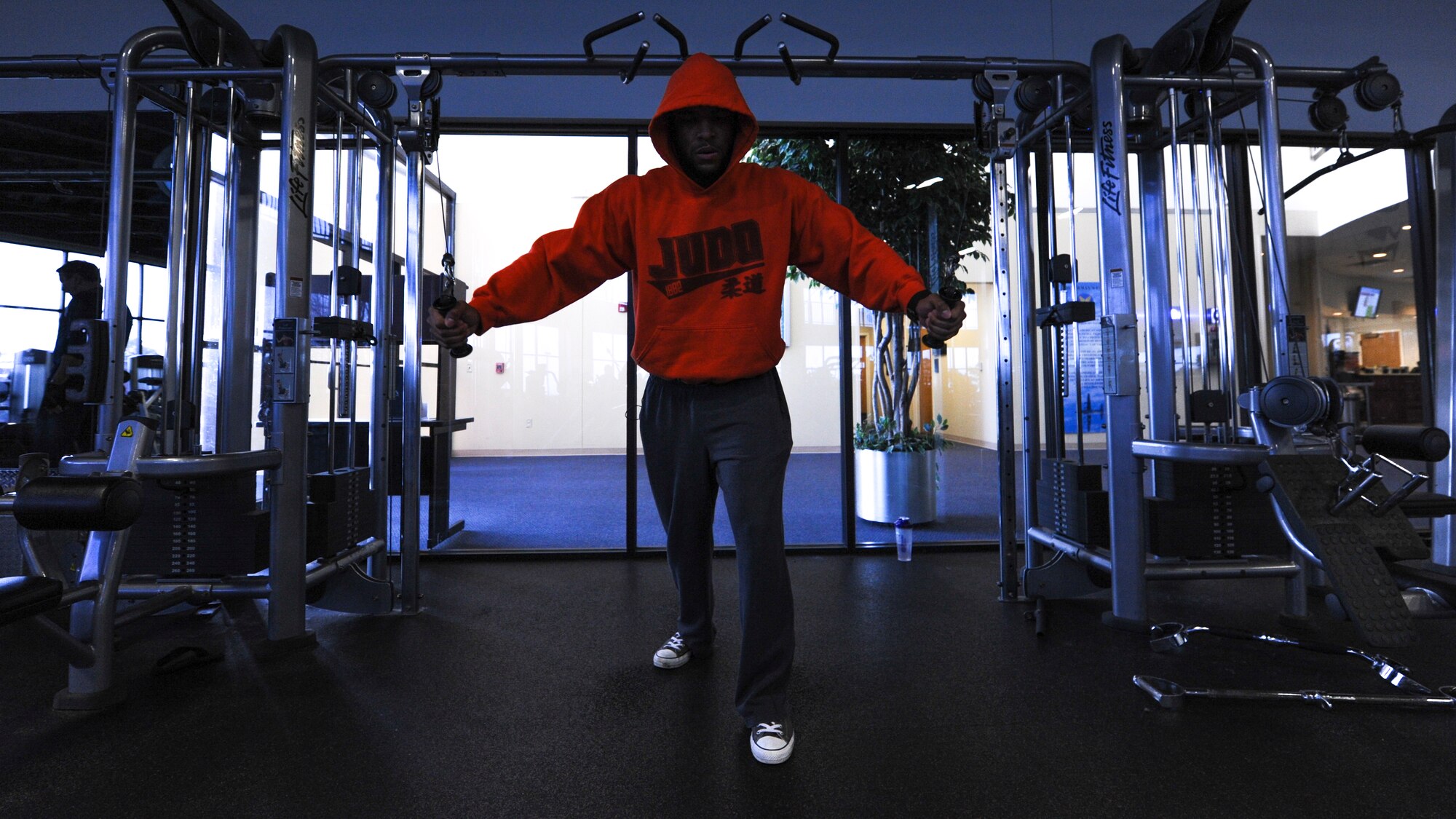 U.S. Air Force Staff Sgt. Keith DeBose, 19th Force Support Squadron Airman Leadership School instructor, does a cable chest-fly at the Fitness Center Jan. 6, 2016, at Little Rock Air Force Base, Ark. In addition to a weight room, the Fitness Center has an aerobics and cardiovascular room. (U.S. Air Force photo by Airman 1st Class Mercedes Taylor) 