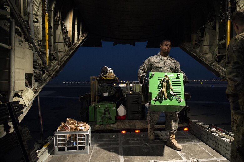 U.S. Air Force Airmen from the 379th Expeditionary Aeromedical Evacuation Squadron load medical equipment onto a C-130H Hercules at Al Udeid Air Base, Qatar in support of Operation Inherent Resolve, Jan. 6, 2016. OIR is the coalition intervention against the Islamic State of Iraq and the Levant. (U.S. Air Force photo by Tech. Sgt. Nathan Lipscomb)