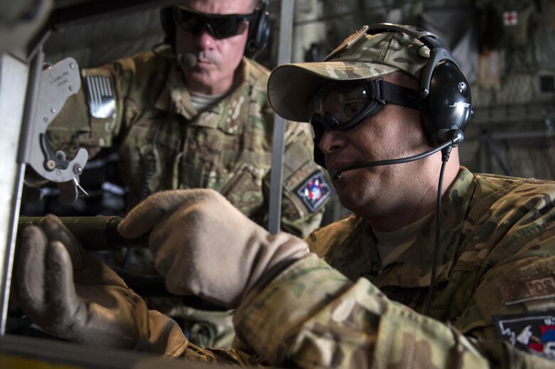 U.S. Air Force Airmen from the 379th Expeditionary Aeromedical Evacuation Squadron assemble medical equipment on a C-130H Hercules to transport injured Airmen in support of Operation Inherent Resolve, Jan. 6, 2016, Al Udeid Air Base, Qatar. OIR is the coalition intervention against the Islamic State of Iraq and the Levant. (U.S. Air Force photo by Tech. Sgt. Nathan Lipscomb)