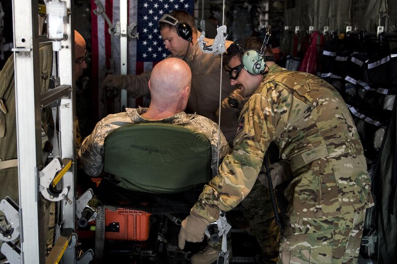 U.S. Air Force Airmen from the 379th Expeditionary Aeromedical Evacuation Squadron treat an injured Airman at an undisclosed location in Southwest Asia in support of Operation Inherent Resolve, Jan. 6, 2016. OIR is the coalition intervention against the Islamic State of Iraq and the Levant. (U.S. Air Force photo by Tech. Sgt. Nathan Lipscomb)