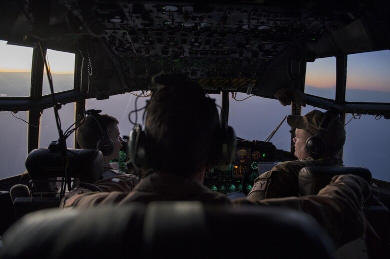 U.S. Air Force Airmen from the 746th Expeditionary Airlift Squadron fly a C-130H Hercules transporting airmen from the 379th Expeditionary Aeromedical Evacuation Squadron as they treat injured Airmen in support of Operation Inherent Resolve, Jan. 6, 2016. OIR is the coalition intervention against the Islamic State of Iraq and the Levant. (U.S. Air Force photo by Tech. Sgt. Nathan Lipscomb)