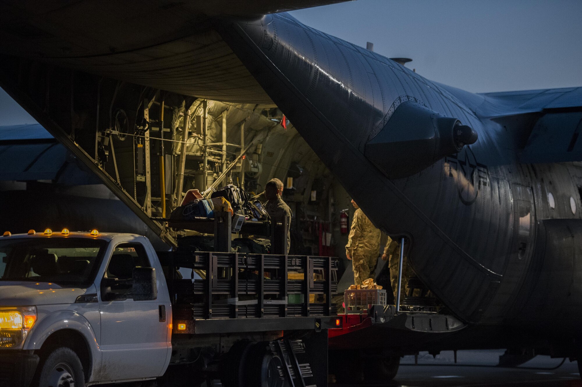 U.S. Air Force Airmen from the 379th Expeditionary Aeromedical Evacuation Squadron load medical equipment onto a C-130H Hercules at Al Udeid Air Base, Qatar in support of Operation Inherent Resolve, Jan. 6, 2016. OIR is the coalition intervention against the Islamic State of Iraq and the Levant. (U.S. Air Force photo by Tech. Sgt. Nathan Lipscomb)