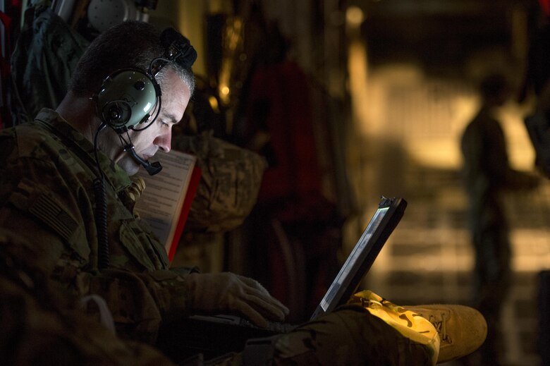 U.S. Air Force Capt. Kevin White, 379th Expeditionary Aeromedical Evacuation Squadron nurse, logs a patient's information into the Electronic Health Record system in Southwest Asia in support of Operation Inherent Resolve, Jan. 6, 2016. The EHR system gives aeromedical evacuation teams the ability update a patient's medical records as they receive treatment during the flight. (U.S. Air Force photo by Tech. Sgt. Nathan Lipscomb)