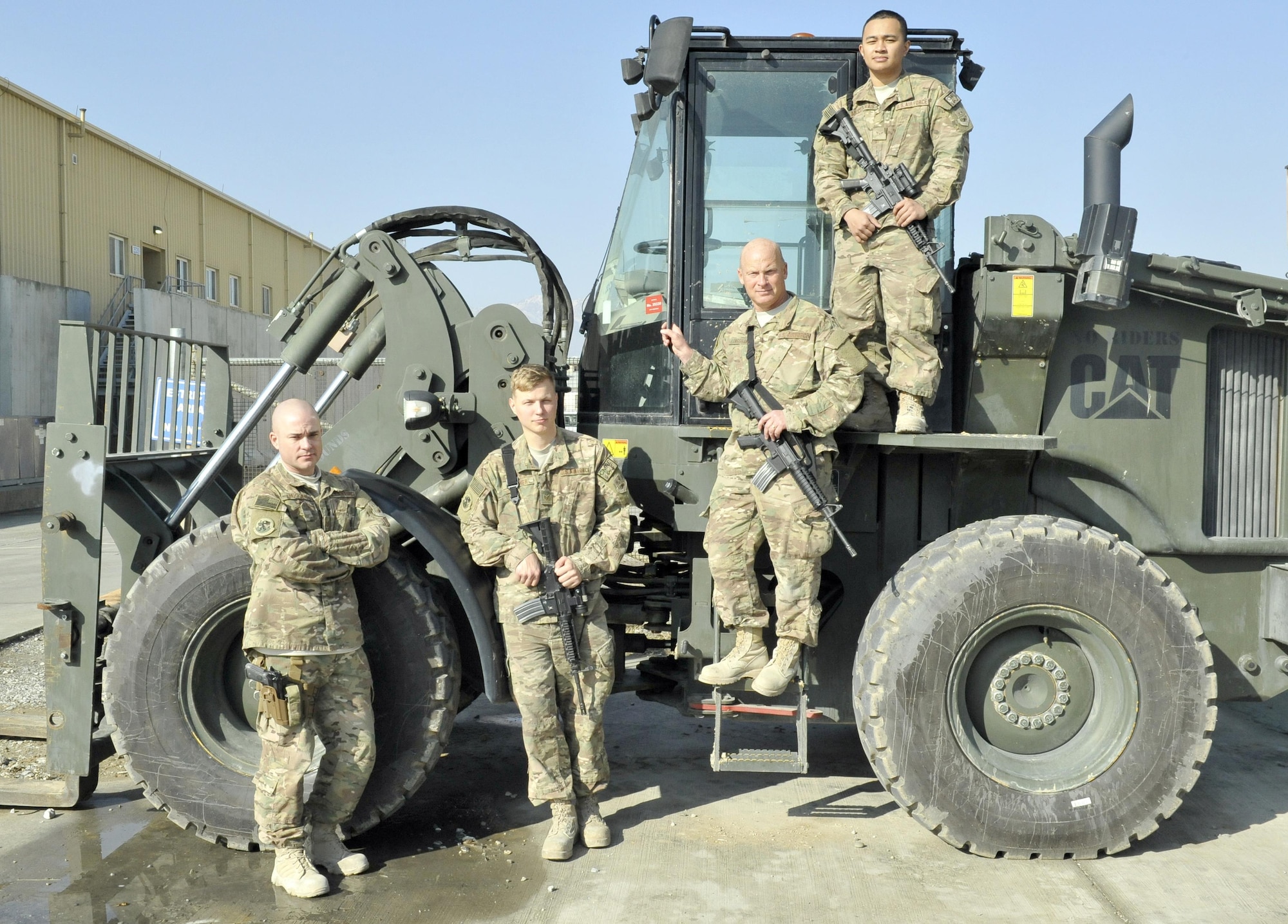 (From left to right) Tech. Sgt. Chad Huggins, Staff Sgt. Tobi Wagner, Master Sgt. Matthew Longshaw and Airman 1st Class John MIchael Aradanas, 455th Expeditionary Logistics Readiness Squadron, were at Hamid Karzai International Airport in Kabul when a vehicle-borne improvised explosive device detonated. The team stepped in to lend a hand in caring for the wounded. (U.S. Air Force photo by Capt. Bryan Bouchard)