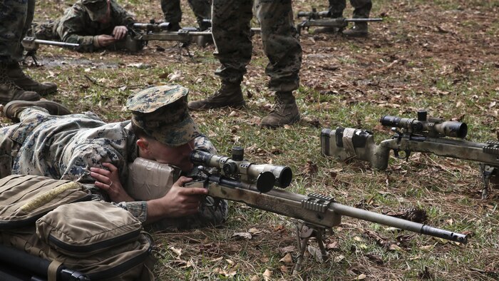 A Marine student undergoing the 2nd Marine Division Combat Skills Center Pre-Scout Sniper Course looks through an M40A5 sniper rifle at Marine Corps Base Camp Lejeune, North Carolina, Jan. 6, 2016. The 2nd Marine Division Combat Skills Center offers several infantry-based courses to enhance the combat readiness of its Marines.