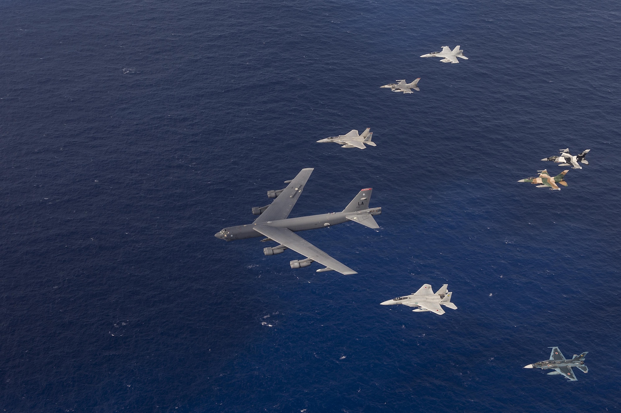 U.S. Air Force, Japan Air Self-Defense Force and Royal Australian air force aircraft fly in formation during Cope North 15, Feb. 17, 2015, off the coast of Guam. During the exercise, the U.S., Japan and Australia air forces worked on developing combat capabilities enhancing air superiority, electronic warfare, air interdiction, tactical airlift and aerial refueling. (U.S. Air Force photo/Tech. Sgt. Jason Robertson)                                                          
