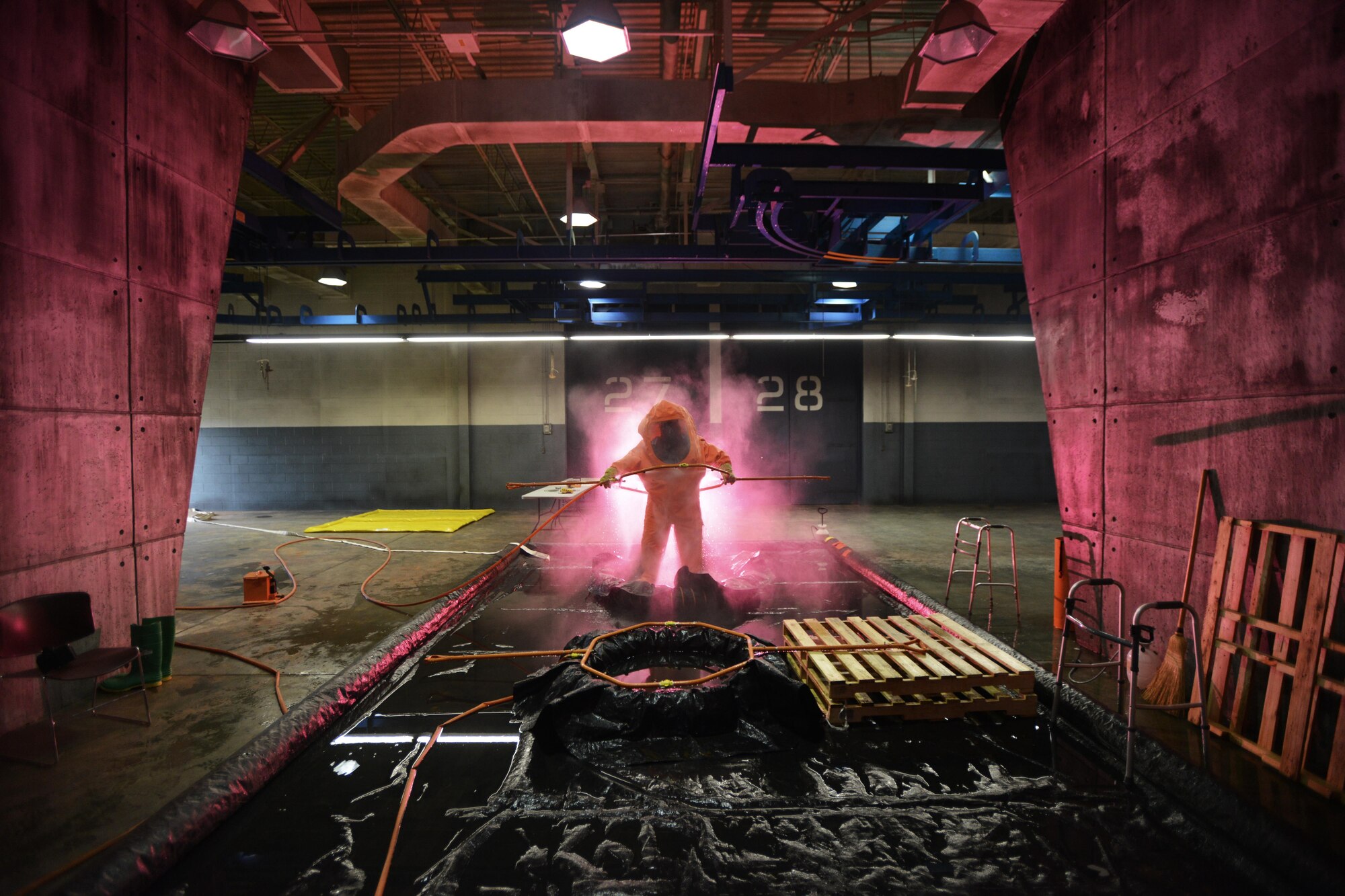 Tech. Sgt. Timothy Cotterall, an Air National Guard emergency manager, is decontaminated following attempts to identify multiple biological contaminants in a simulated lab during a Global Dragon training event on March 18, 2015. Held at the Guardian Centers of Georgia, Global Dragon Deployment For Training provides a refresher course for Airmen, allowing them to put their skills to use to identify live chemical, biological, radiological and nuclear agents and materials. Air National Guard emergency management technicians from more than 20 individual units participated in Global Dragon. Cotterall is a member of the 137th Air Refueling Wing in New Jersey. (New York Air National Guard / Staff Sgt. Christopher S. Muncy / released)