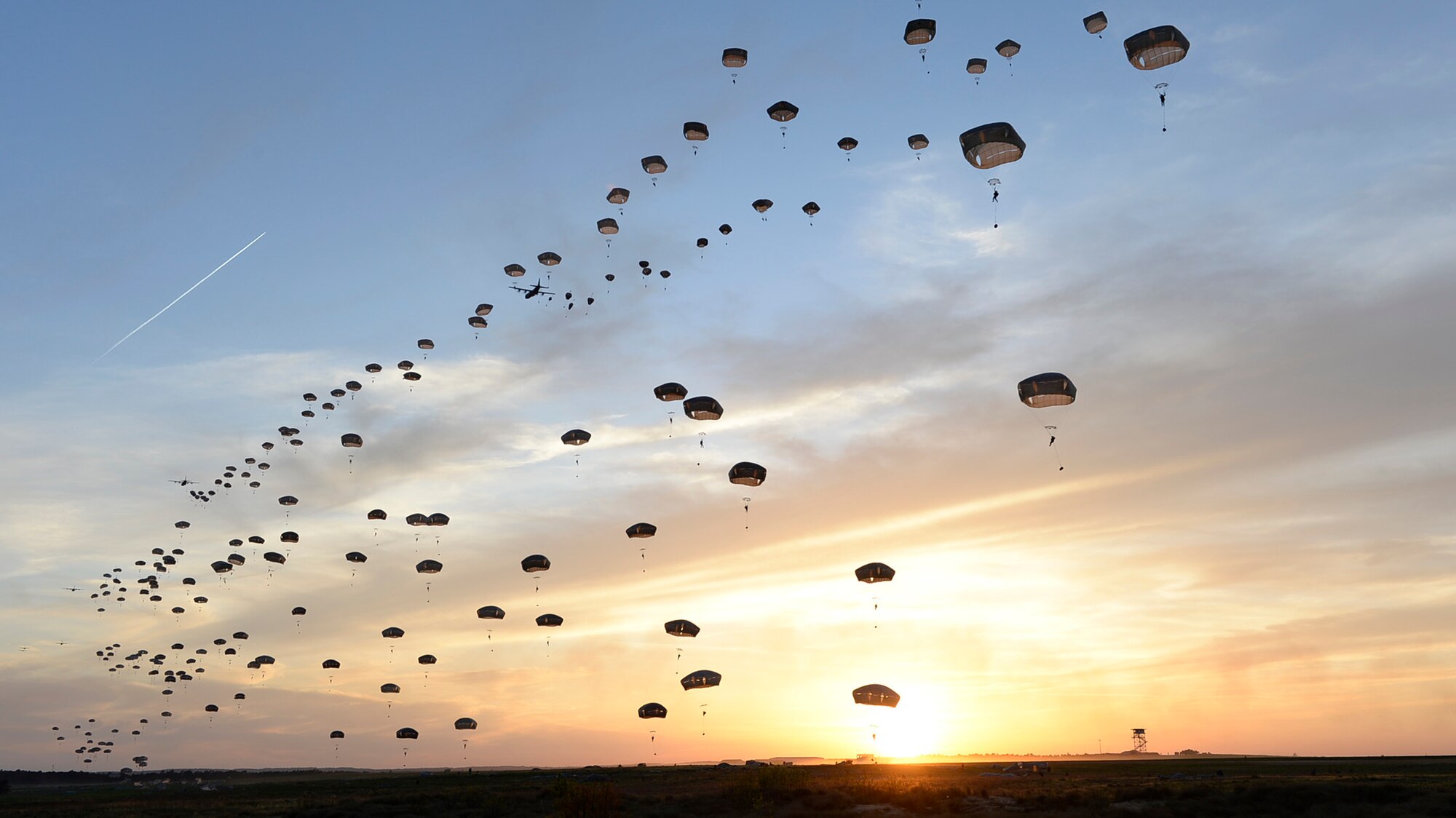 Several C-130J Super Hercules assigned to the 317th Airlift Group at Dyess Air Force Base, Texas, help U.S. Army and British paratroopers perform a static line jump at Holland Drop Zone in preparation for Combined Joint Operational Access Exercise 15-01 at Fort Bragg, N.C., April 11, 2015. This was the largest exercise of its kind held at Fort Bragg in nearly 20 years and demonstrated interoperability between the U.S. Air Force, Air National Guard, Royal Air Force, U.S. Marine Corps, U.S. Army and British Army. (U.S. Air Force photo/Staff Sgt. Sean Martin)