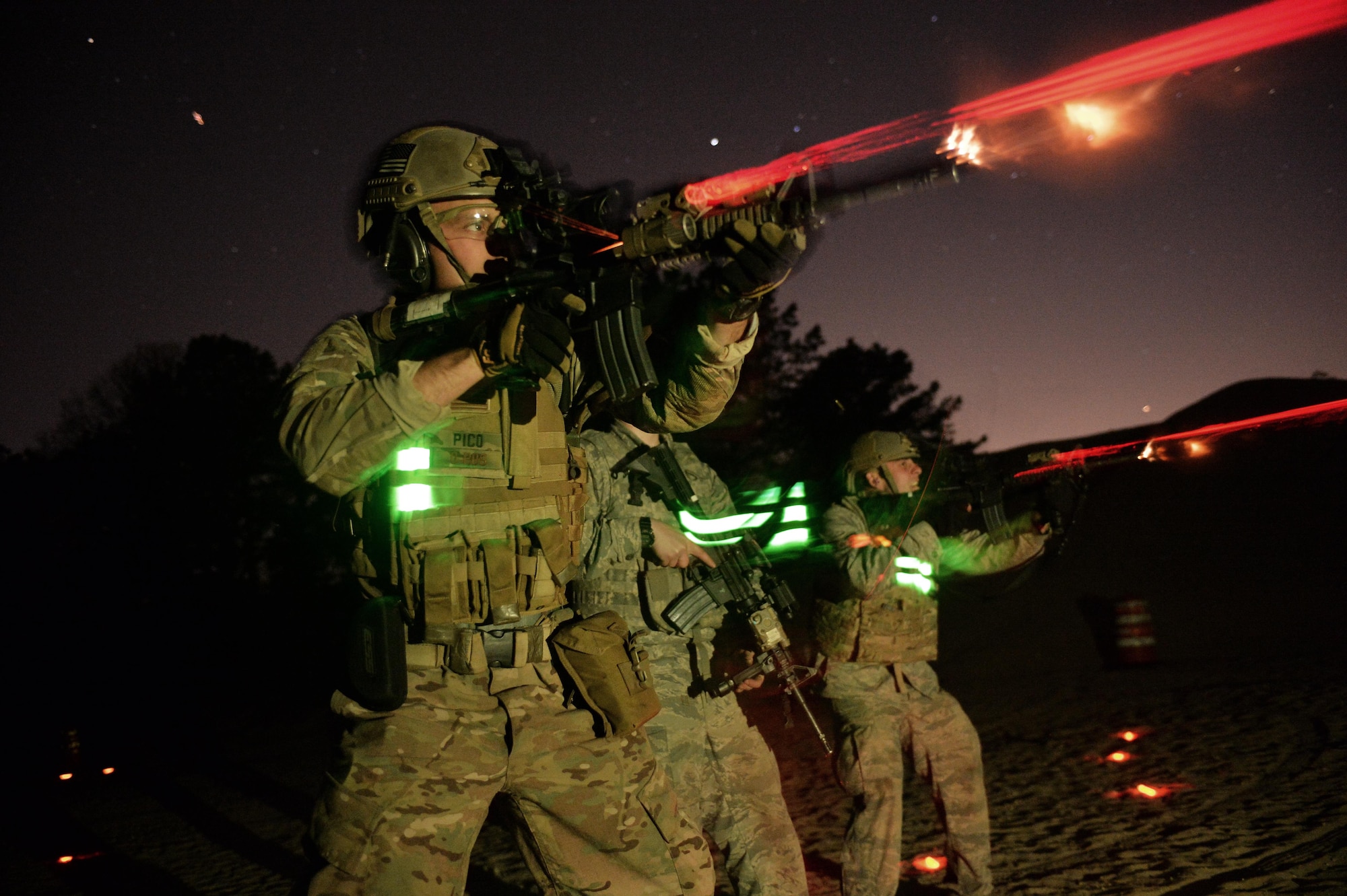 Staff Sgt. Joseph Pico, a security forces Airman with the 106th Rescue Wing, conducts night-firing training at the Suffolk County Police Range in Westhampton Beach, N.Y., May 7, 2015. During the training, Airmen learned small-group tactics, how to use their night vision gear and trained with visible and infrared designators. (New York Air National Guard photo/Staff Sgt. Christopher S. Muncy)