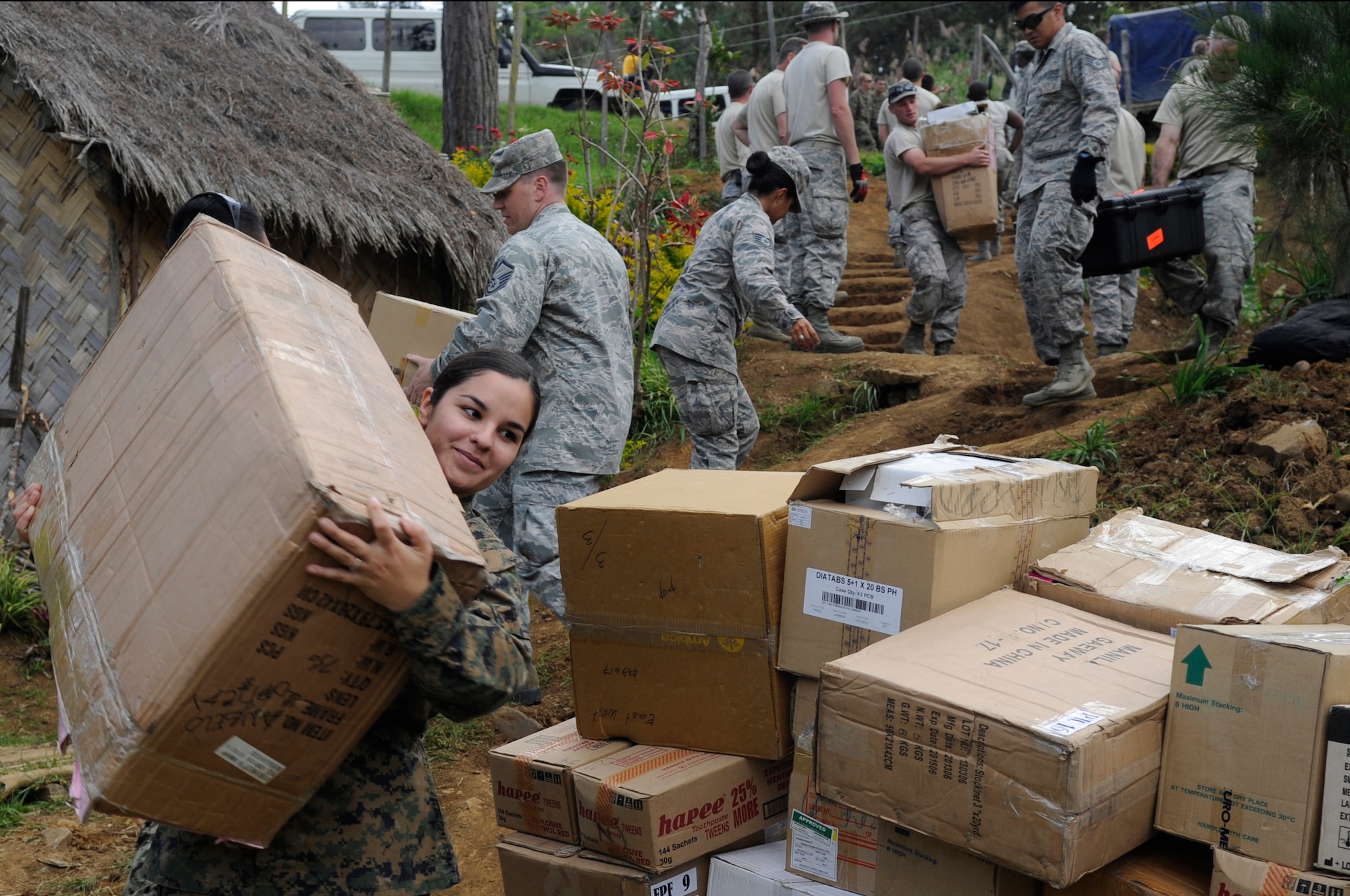 Marine Corps Hospital Corpsman Melissa Irvin, a 1st Dental Battalion dental corpsman from Camp Pendleton, Calif., carries a box of medical supplies to Unggai Primary School, where medical professionals are setting up during Pacific Angel 15-4 at Eastern Highlands, Papua New Guinea, May 29, 2015. Efforts undertaken during Pacific Angel help multilateral militaries in the Pacific improve and build relationships across a wide spectrum of civic operations, which bolsters each nation’s capacity to respond and support future humanitarian assistance and disaster relief operations. (U.S. Air Force photo/Staff Sgt. Marcus Morris)