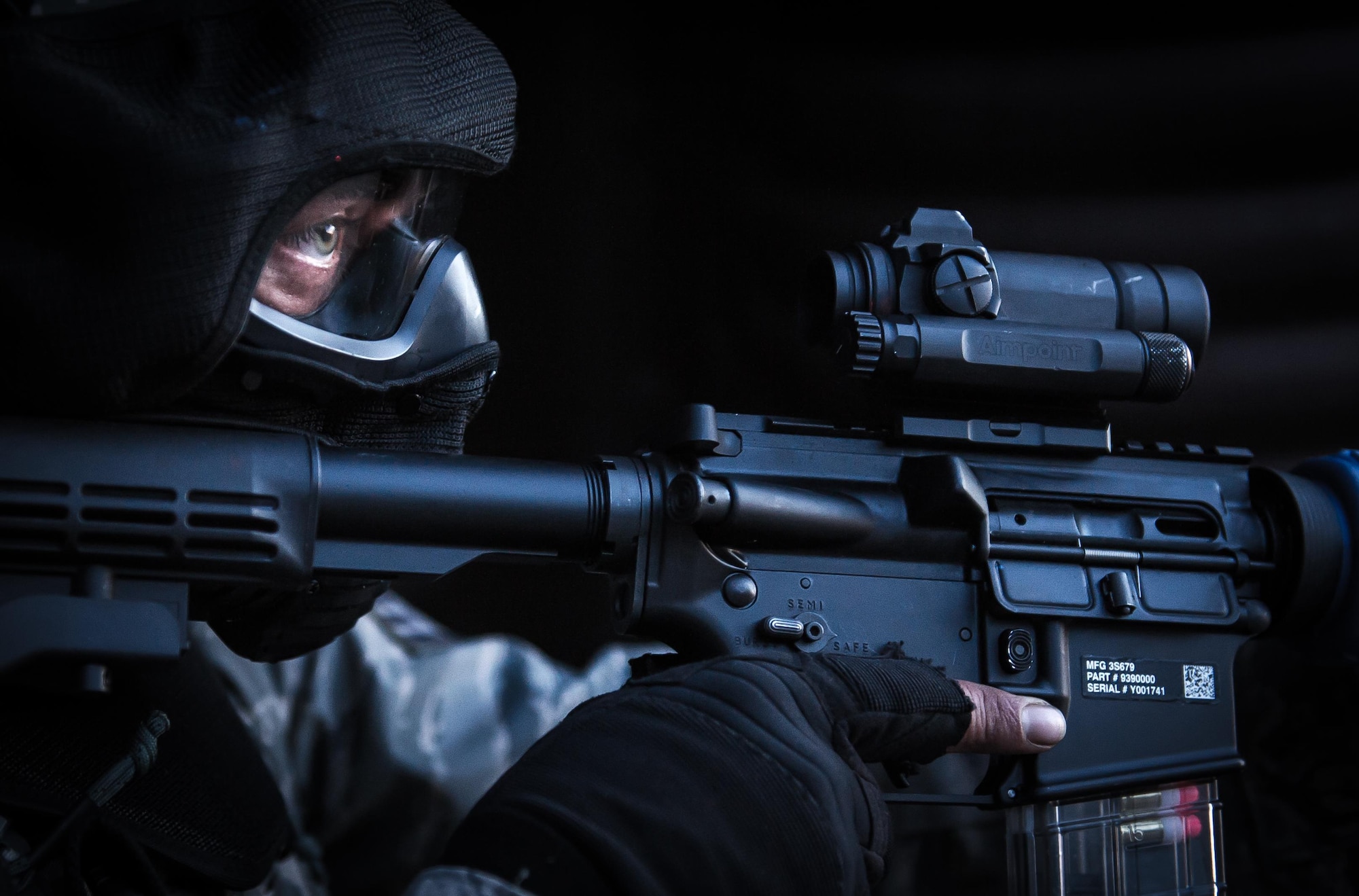 A security forces Airman secures the outside of a hardened facility after neutralizing the opposing force during a combat training course on Ramstein Air Base, Germany, May 30, 2015. The Battlefield Leaders Assaulter Course, Integrated Combat Essentials is designed to teach security forces members from multiple countries advanced tactics and shooting skills for use in the event of a base security breach. (U.S. Air Force photo/Tech. Sgt. Ryan Crane)