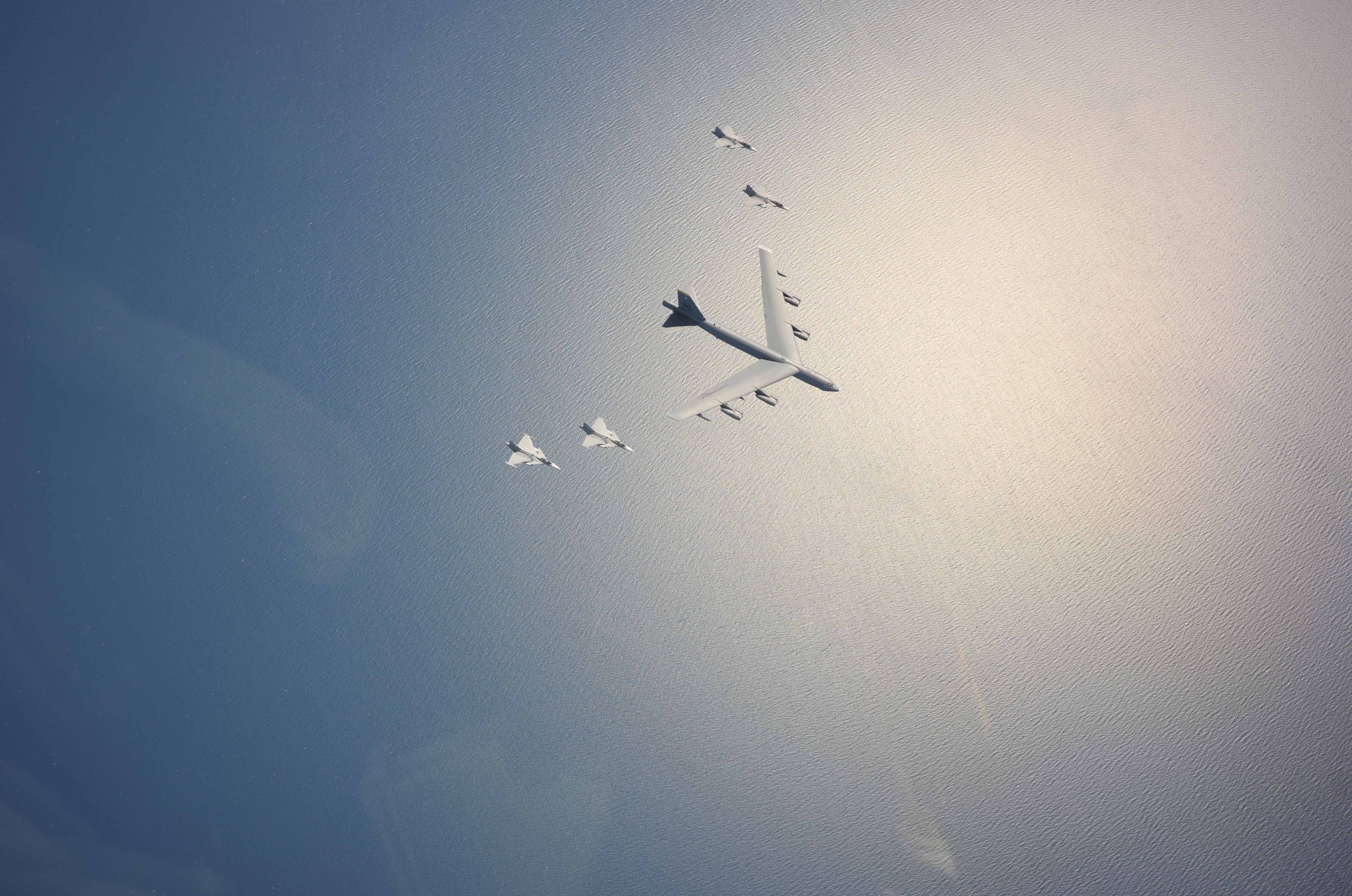 A U.S. Air Force B-52 Stratofortress flies with Swedish Saab Gripens during Baltic Operations 2015. Baltic Operations is an annual multinational exercise designed to enhance flexibility and interoperability, as well as demonstrate resolve among allied and partner forces to defend the Baltic region. (U.S. Navy photo)  